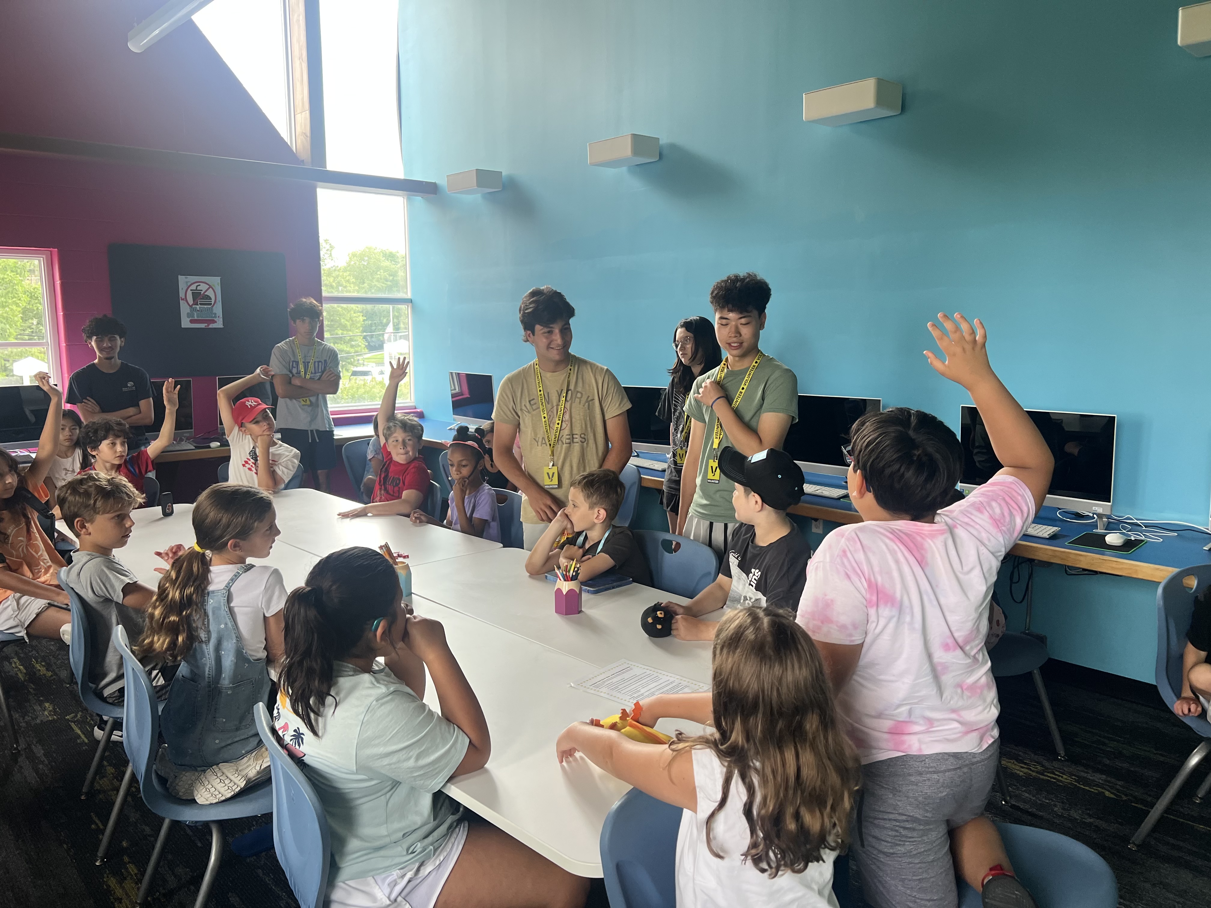 A hands-up moment during a money-basics session.